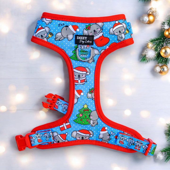 Adjustable dog harness with a Christmas koalas theme, featuring red, blue, and green colors and koalas wearing Christmas hats and a Christmas tree.