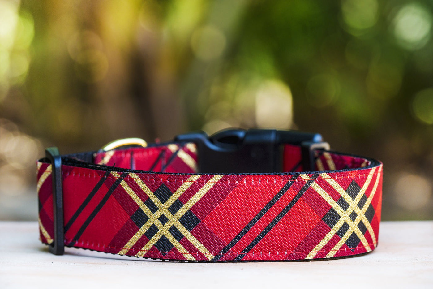 a red and gold dog collar, with woven gold glitter throughout. Handmade in Australia, this dog collar is a beautiful addition for larger dogs.